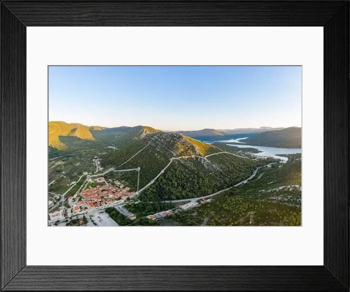Framed Print : Aerial drone shot of Ston city wall over hill in Ragusa region near Dubrovnik in Croatia summer sunrise Framed Print : Aerial drone shot of Ston city wall over hill in Ragusa region near Dubrovnik in Croatia summer sunrise