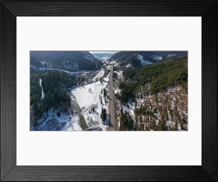 Framed Print : Aerial view on mountain road from drone in winter Framed Print : Aerial view on mountain road from drone in winter
