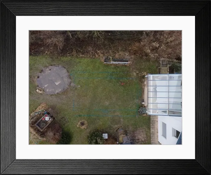 Framed Print : aerial drone shot of small, yellow excavator stands in a large garden and digs a hole for a pool in austria Framed Print : aerial drone shot of small, yellow excavator stands in a large garden and digs a hole for a pool in austria