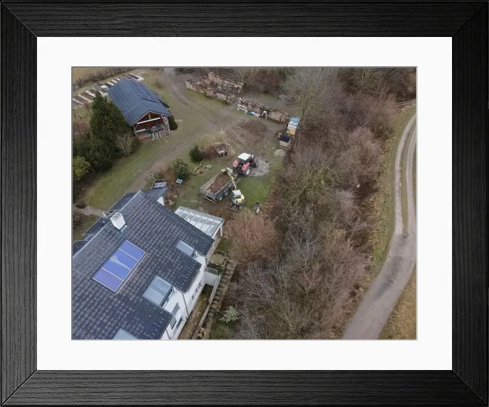Framed Print : aerial drone shot of small, yellow excavator stands in a large garden and digs a hole for a pool in austria Framed Print : aerial drone shot of small, yellow excavator stands in a large garden and digs a hole for a pool in austria