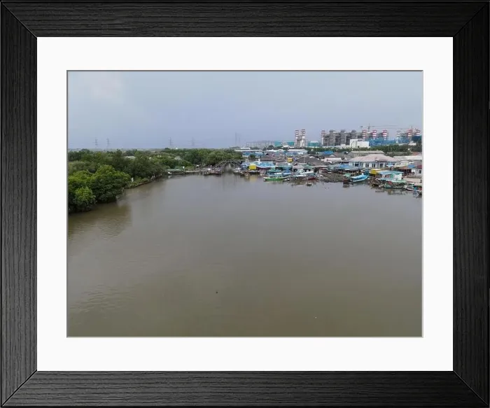 Framed Print : Aerial view of fisherman village and mangrove forest in rainy season. Bekasi, Indonesia, March 9, 2021 Framed Print : Aerial view of fisherman village and mangrove forest in rainy season. Bekasi, Indonesia, March 9, 2021