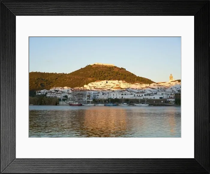 Framed Print : Sanlucar de Guadiana in Spain and Alcoutim in Portugal with sail boats on Guadiana river Framed Print : Sanlucar de Guadiana in Spain and Alcoutim in Portugal with sail boats on Guadiana river