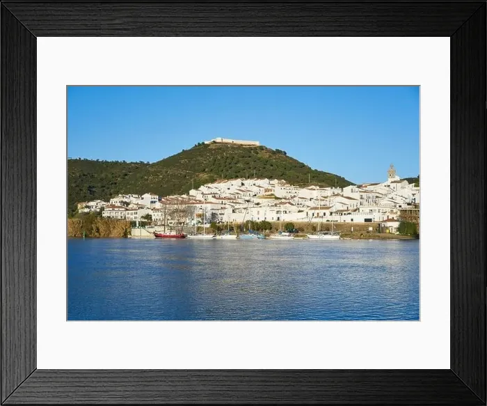 Framed Print : Sanlucar de Guadiana in Spain and Alcoutim in Portugal with sail boats on Guadiana river Framed Print : Sanlucar de Guadiana in Spain and Alcoutim in Portugal with sail boats on Guadiana river