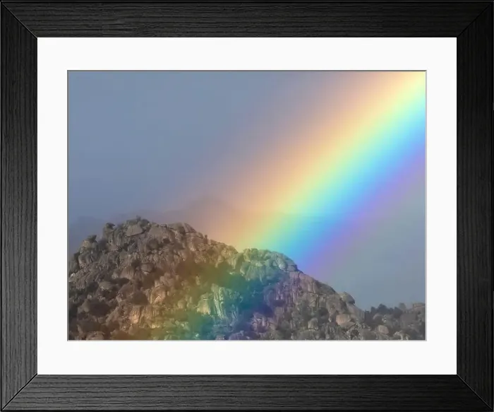 Framed Print : Vivid rainbow on cloudy sky over mountain ridge