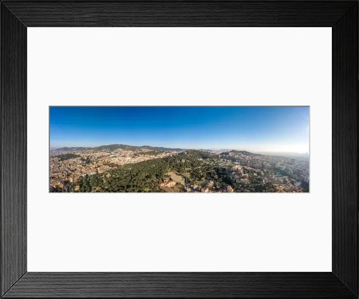 Framed Print : Aerial panorama drone shot of of hill near Barcelona city in morning hour with view of agbar tower in distatnt in Spain Framed Print : Aerial panorama drone shot of of hill near Barcelona city in morning hour with view of agbar tower in distatnt in Spain