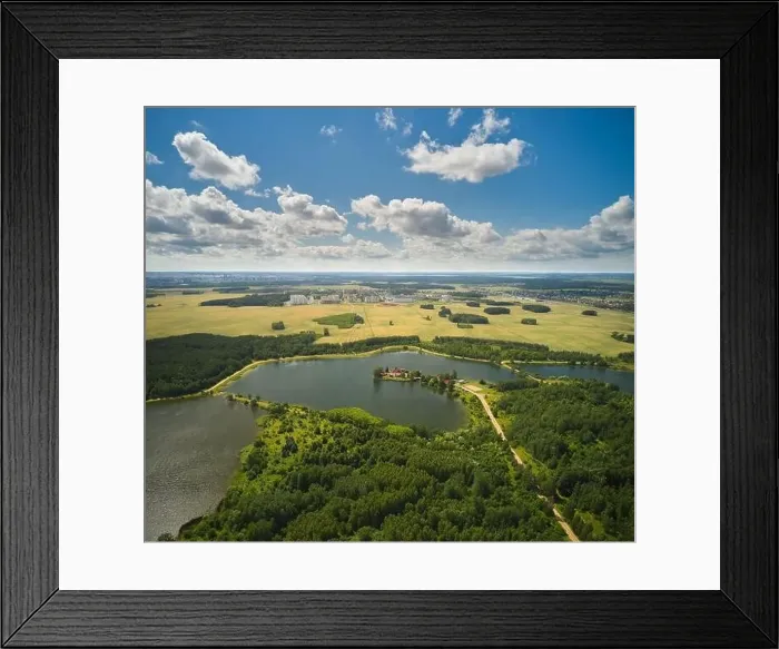 Framed Print : Aerial view of country road in green summer forest and blue lake