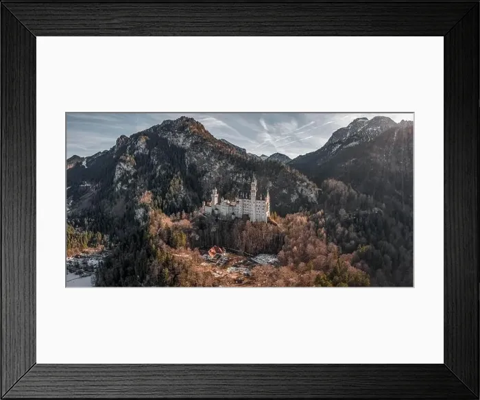 Framed Print : Aerial panorama drone shot of picturesque Neuschwanstein Castle on snowy hill in winter sunlight in Germany Framed Print : Aerial panorama drone shot of picturesque Neuschwanstein Castle on snowy hill in winter sunlight in Germany