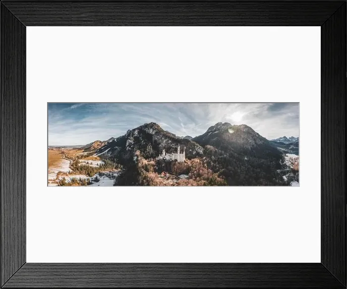 Framed Print : Aerial panorama drone shot of picturesque Neuschwanstein Castle on snowy hill in winter sunlight in Germany Framed Print : Aerial panorama drone shot of picturesque Neuschwanstein Castle on snowy hill in winter sunlight in Germany