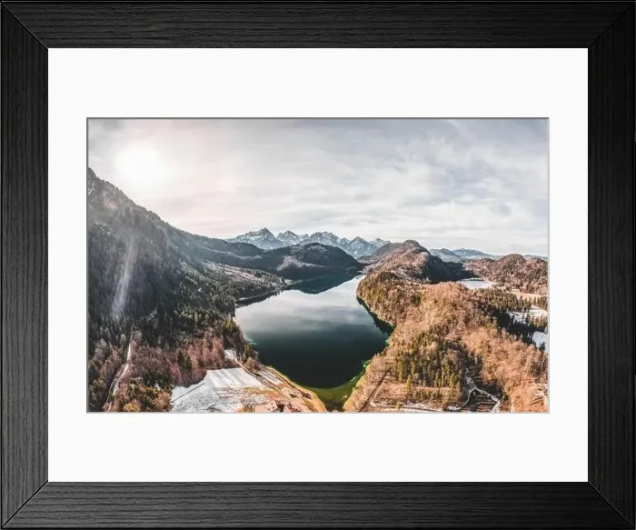 Framed Print : Aerial drone shot of Alpsee lake in Fussen with view of Alps snow mountain range in Germany winter Framed Print : Aerial drone shot of Alpsee lake in Fussen with view of Alps snow mountain range in Germany winter