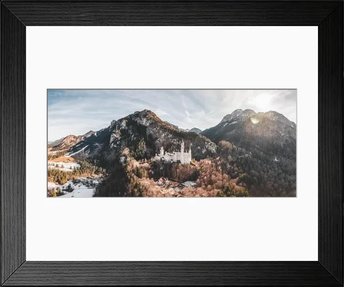 Framed Print : Aerial panorama drone shot of picturesque Neuschwanstein Castle on snowy hill in winter sunlight in Germany Framed Print : Aerial panorama drone shot of picturesque Neuschwanstein Castle on snowy hill in winter sunlight in Germany