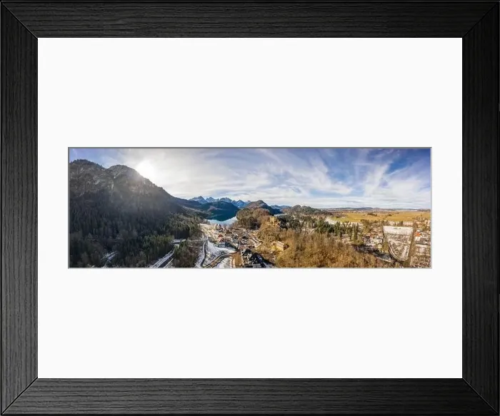 Framed Print : Aerial panorama drone shot of Hohenschwangau by lake in Fussen with view of Alps snow mountain range in Germany winter Framed Print : Aerial panorama drone shot of Hohenschwangau by lake in Fussen with view of Alps snow mountain range in Germany winter