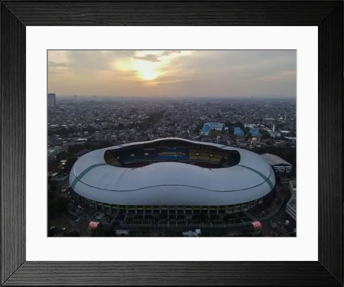 Framed Print : Aerial View of The largest stadium of Bekasi from drone when sunset and noise cloud. Bekasi, Indonesia, March 21, 2021 Framed Print : Aerial View of The largest stadium of Bekasi from drone when sunset and noise cloud. Bekasi, Indonesia, March 21, 2021