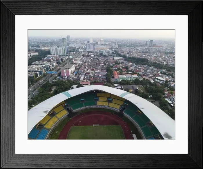 Framed Print : Aerial View of The largest stadium of Bekasi from drone when sunset and noise cloud. Bekasi, Indonesia, March 21, 2021 Framed Print : Aerial View of The largest stadium of Bekasi from drone when sunset and noise cloud. Bekasi, Indonesia, March 21, 2021