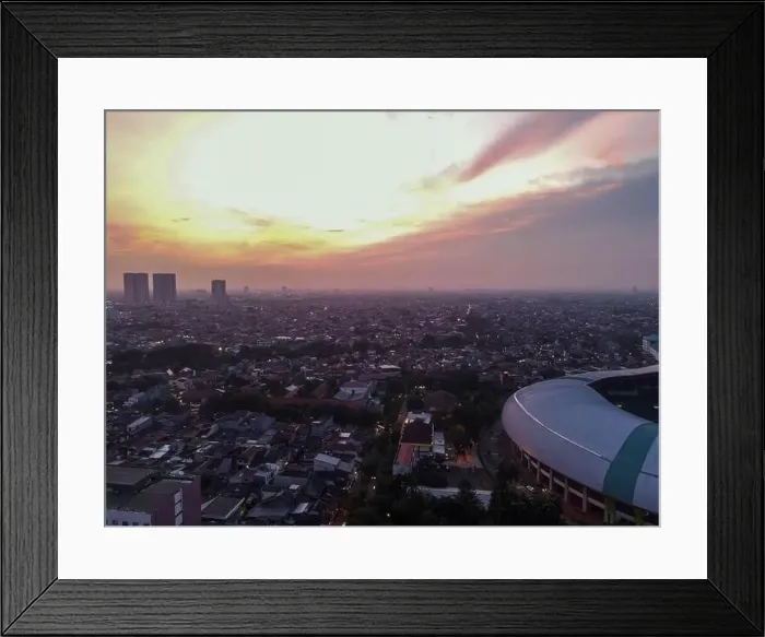 Framed Print : Aerial View of The largest stadium of Bekasi from drone when sunset and noise cloud. Bekasi, Indonesia, March 21, 2021 Framed Print : Aerial View of The largest stadium of Bekasi from drone when sunset and noise cloud. Bekasi, Indonesia, March 21, 2021