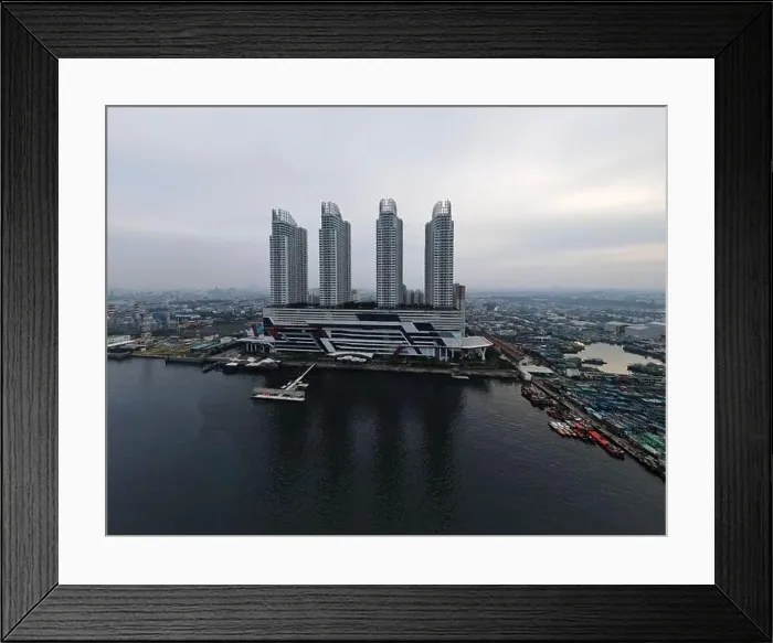 Framed Print : Aerial drone view of Muara Angke Beach with wooden boats leaning beside the pier Framed Print : Aerial drone view of Muara Angke Beach with wooden boats leaning beside the pier
