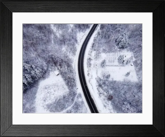 Framed Print : High angle top down aerial view drone image on road trough the trees