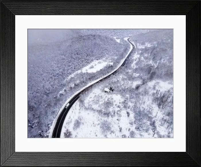 Framed Print : High angle aerial view drone image on the road trough the trees