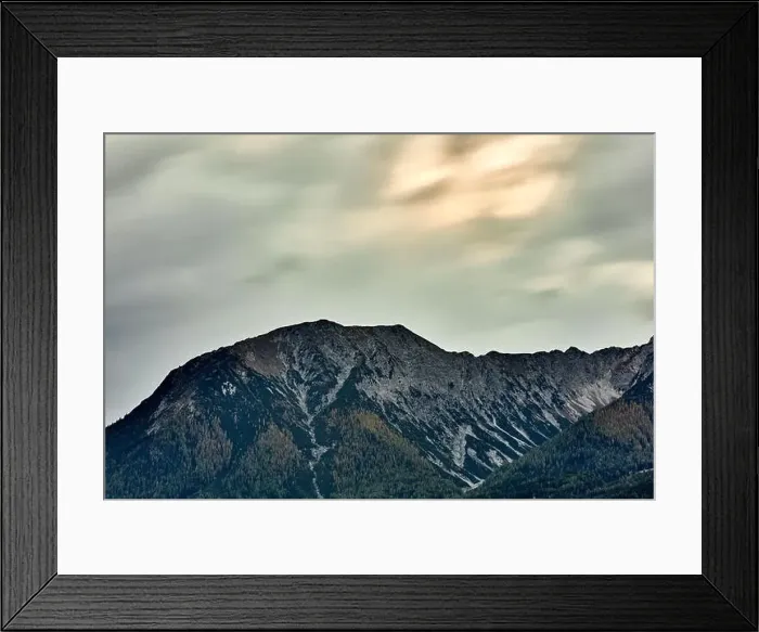 Framed Print : a large mountain landscape with cloudy sky Framed Print : a large mountain landscape with cloudy sky