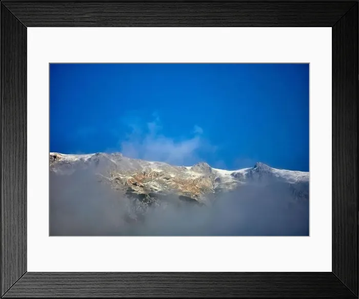 Framed Print : a white mountains with fog and blue sky Framed Print : a white mountains with fog and blue sky