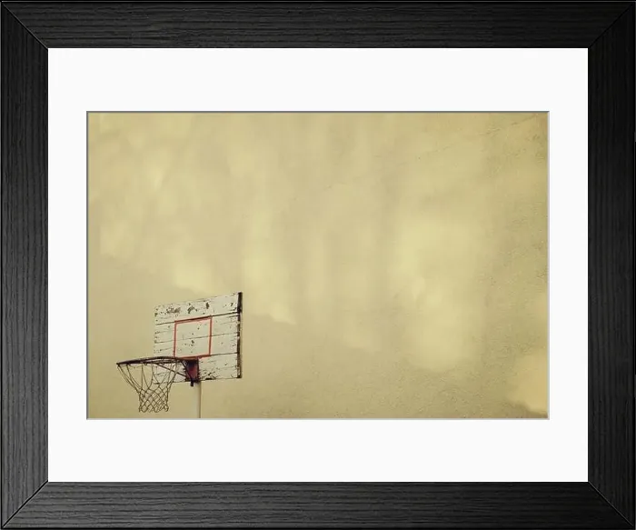 Framed Print : Basketball hoop in the backyard on yellow wall with copy space Framed Print : Basketball hoop in the backyard on yellow wall with copy space