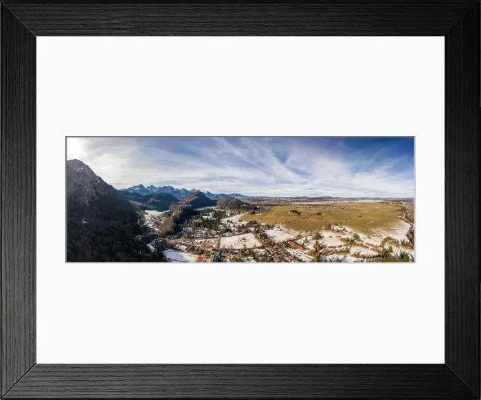 Framed Print : Aerial panorama drone shot of Alpine mountain range near Neuschwanstein castle in Germany winter Framed Print : Aerial panorama drone shot of Alpine mountain range near Neuschwanstein castle in Germany winter