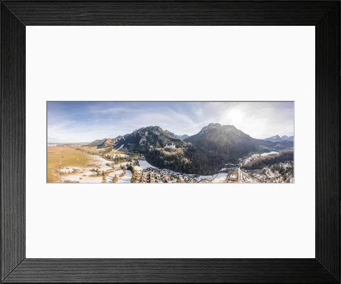 Framed Print : Aerial panorama drone shot of picturesque Neuschwanstein Castle on snowy hill in winter sunlight in Germany Framed Print : Aerial panorama drone shot of picturesque Neuschwanstein Castle on snowy hill in winter sunlight in Germany