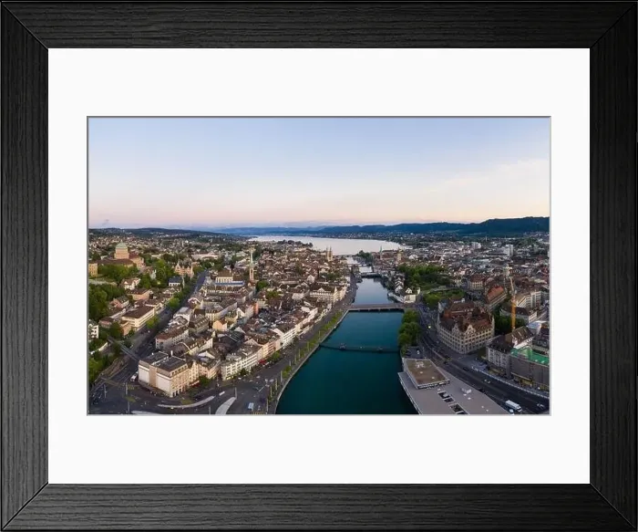Framed Print : Aerial view of the sunset over Zurich old town and dwontown district with the Limmat river Framed Print : Aerial view of the sunset over Zurich old town and dwontown district with the Limmat river