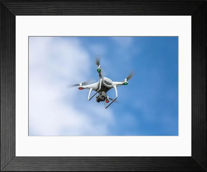 Framed Print : Drone quadrocopter with high resolution digital camera on the sky background Framed Print : Drone quadrocopter with high resolution digital camera on the sky background