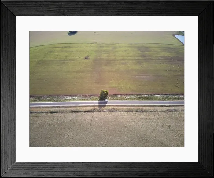 Framed Print : Australia highway aerial view showing rural highway, vehicle, fields and farmland, Victoria, Australia Framed Print : Australia highway aerial view showing rural highway, vehicle, fields and farmland, Victoria, Australia