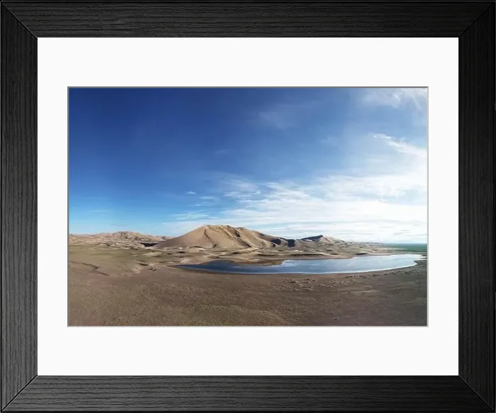 Framed Print : A large lake on the edge of a sandy desert. Mongolia sandy dune desert Mongol Els. Khovd province, Western Mongolia
