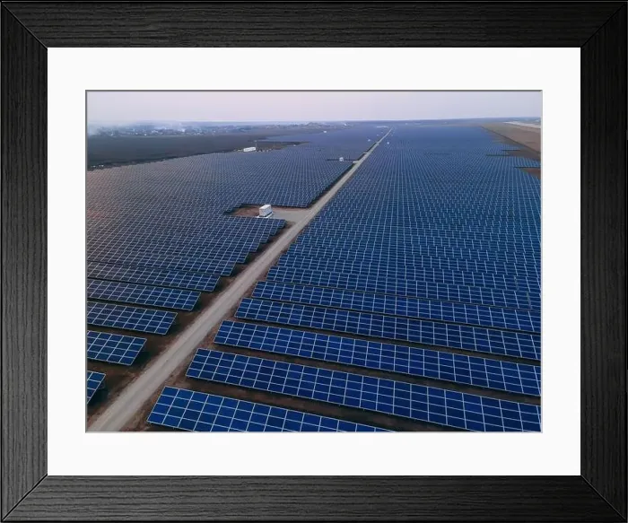 Framed Print : Aerial drone view of large solar panels at a solar farm at bright spring windy sunset Framed Print : Aerial drone view of large solar panels at a solar farm at bright spring windy sunset