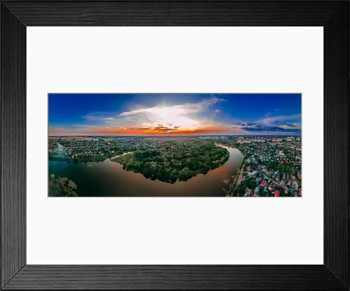 Framed Print : Aerial panoramic view of of small european city placed on river banks at summer sunny day with clouds Framed Print : Aerial panoramic view of of small european city placed on river banks at summer sunny day with clouds