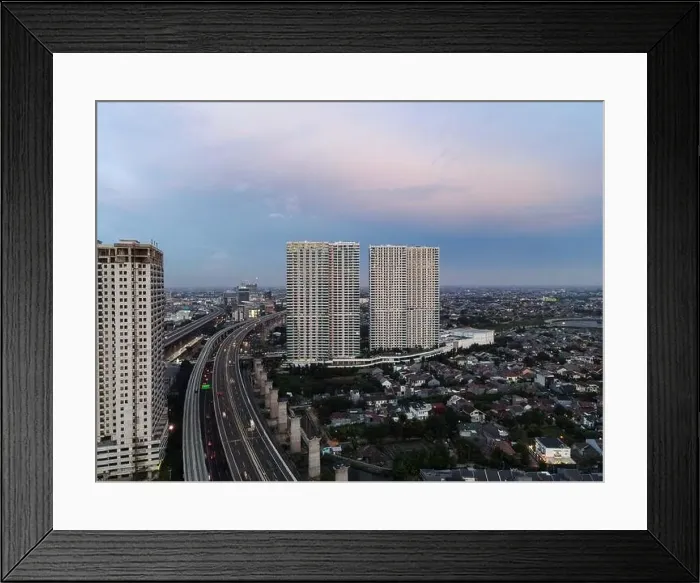 Framed Print : Aerial view of highway intersection and buildings in the city of Bekasi and noise cloud with Bekasi cityscape Framed Print : Aerial view of highway intersection and buildings in the city of Bekasi and noise cloud with Bekasi cityscape
