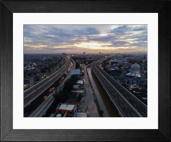 Framed Print : Aerial view of highway intersection and buildings in the city of Bekasi and noise cloud with Bekasi cityscape