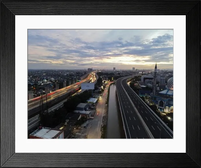 Framed Print : Aerial view of highway intersection and buildings in the city of Bekasi and noise cloud with Bekasi cityscape Framed Print : Aerial view of highway intersection and buildings in the city of Bekasi and noise cloud with Bekasi cityscape