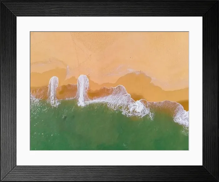 Framed Print : Aerial view of a beach and waves along the sea