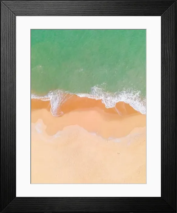Framed Print : Aerial view of a beach and waves along the sea Framed Print : Aerial view of a beach and waves along the sea