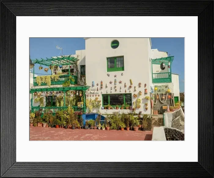 Framed Print : Punta Mujeres, Spain - 18 January 2021: rustical house at the village of Punta Mujeres on Lanzarote island in Spain Framed Print : Punta Mujeres, Spain - 18 January 2021: rustical house at the village of Punta Mujeres on Lanzarote island in Spain