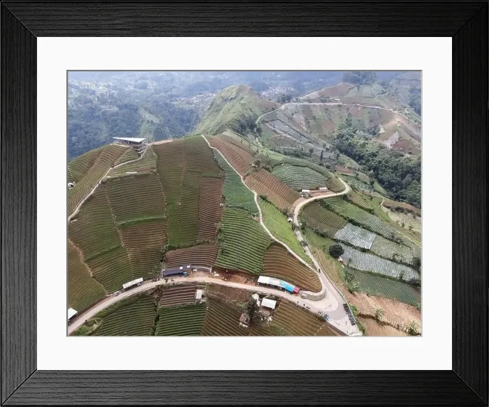 Framed Print : Aerial view of World heritage Panyaweuyan rice terraces in Majalengka with noise cloud Framed Print : Aerial view of World heritage Panyaweuyan rice terraces in Majalengka with noise cloud