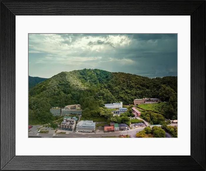 Framed Print : Mountain and buildings near Kawaguchi lake under overcast sky Framed Print : Mountain and buildings near Kawaguchi lake under overcast sky