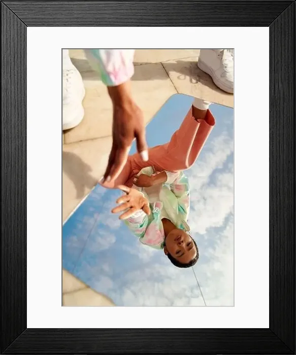 Framed Print : Reflection of young short-haired woman touching shiny mirror outdoors Framed Print : Reflection of young short-haired woman touching shiny mirror outdoors