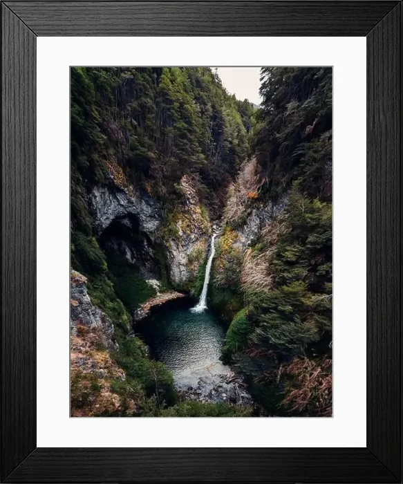 Framed Print : Spectacular drone view of powerful stream of waterfall flowing in lake in mountainous forest Framed Print : Spectacular drone view of powerful stream of waterfall flowing in lake in mountainous forest