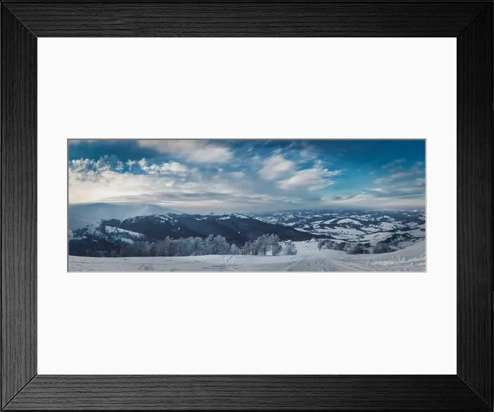 Framed Print : View of the stunning winter panorama of the snowy slopes and hills among the lush white clouds Framed Print : View of the stunning winter panorama of the snowy slopes and hills among the lush white clouds