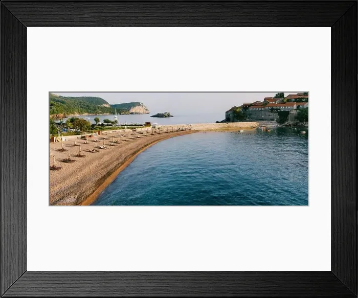 Framed Print : Panorama view of a narrow beach with sun loungers Framed Print : Panorama view of a narrow beach with sun loungers