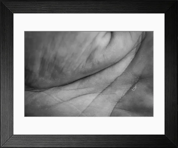 Framed Print : Macro view in black and white of a palm of a human male hand with lines and skin texture Framed Print : Macro view in black and white of a palm of a human male hand with lines and skin texture