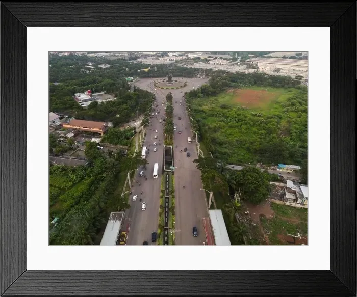 Framed Print : Aerial top down of traffic in Bekasi roundabout during sunny day. Cars passing road. Bekasi. Indonesia. May, 6 2021 Framed Print : Aerial top down of traffic in Bekasi roundabout during sunny day. Cars passing road. Bekasi. Indonesia. May, 6 2021