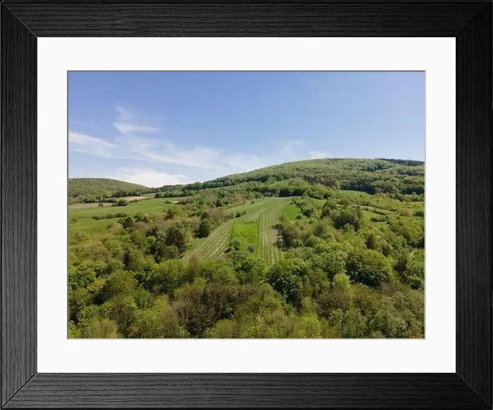 Framed Print : aerial drone flight photo of green hills, meadows and fresh forest in Lower Austria at the edge of Vienna Woods Framed Print : aerial drone flight photo of green hills, meadows and fresh forest in Lower Austria at the edge of Vienna Woods
