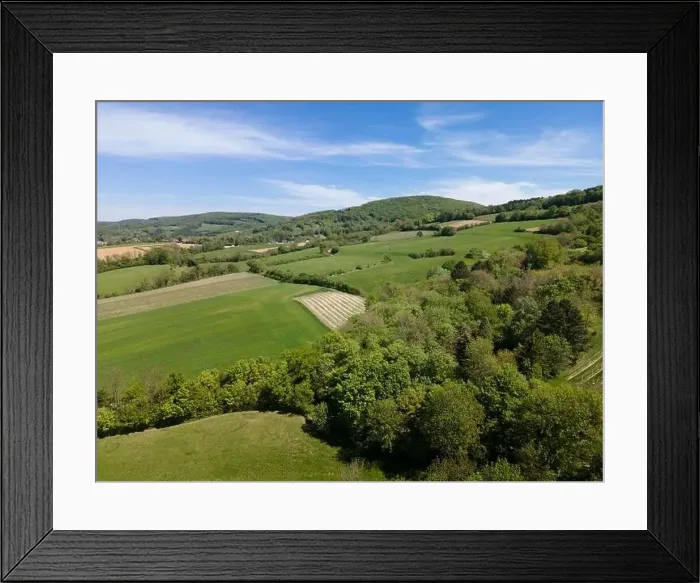 Framed Print : aerial drone flight photo of green hills, meadows and fresh forest in Lower Austria at the edge of Vienna Woods