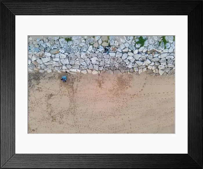 Framed Print : Aerial view of a few people sitting on the beach and looking the sunset at Costa da Caparica, Setubal, Portugal Framed Print : Aerial view of a few people sitting on the beach and looking the sunset at Costa da Caparica, Setubal, Portugal