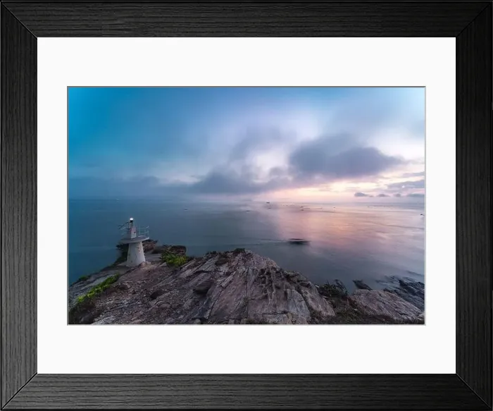Framed Print : Sunrise by the sea with a lighthouse on the cliff Framed Print : Sunrise by the sea with a lighthouse on the cliff